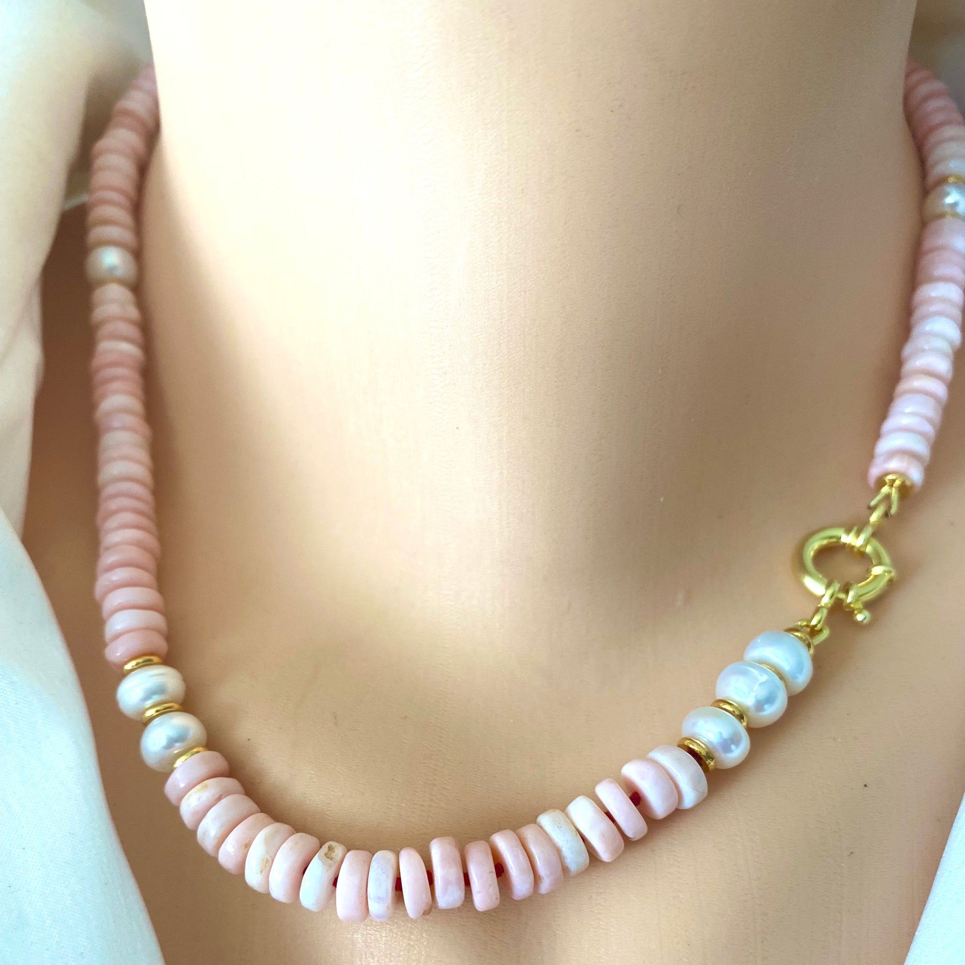 Pink opal pearl necklace worn without pendant showing pink opal and pearl bead detail