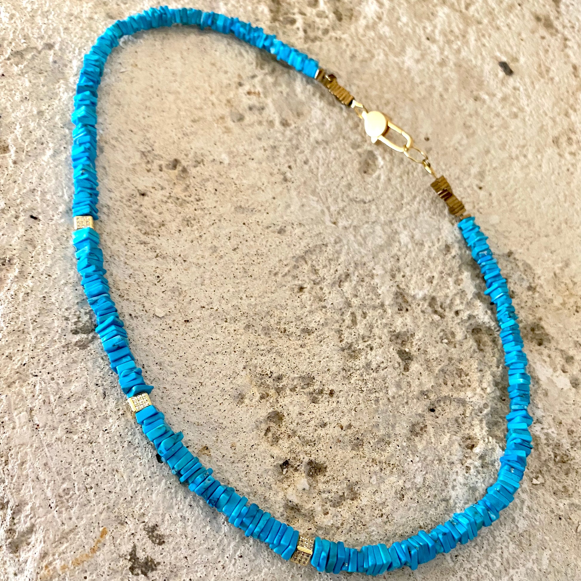 Turquoise choker necklace with natural turquoise beads showcasing vibrant color and modern elegance.