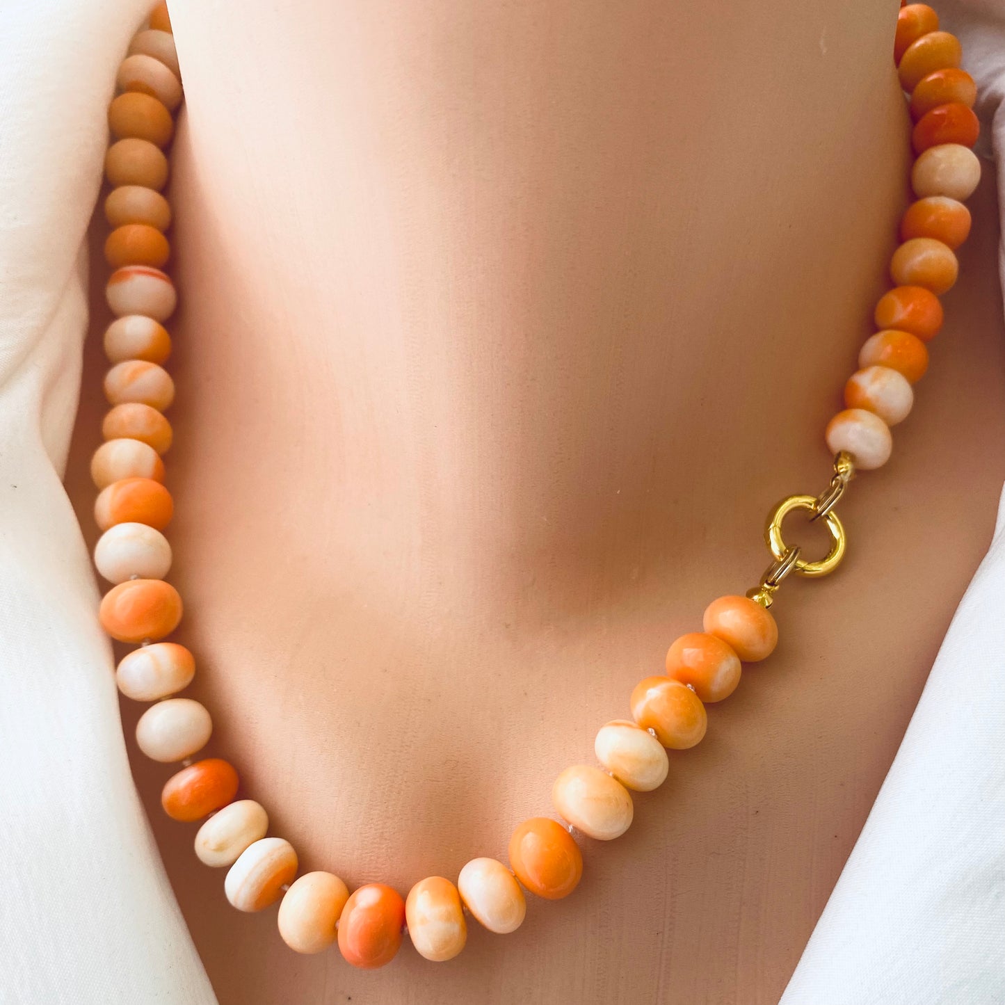 Orange opal candy necklace close-up on neckline, shaded orange gemstone beads handcrafted in Canada