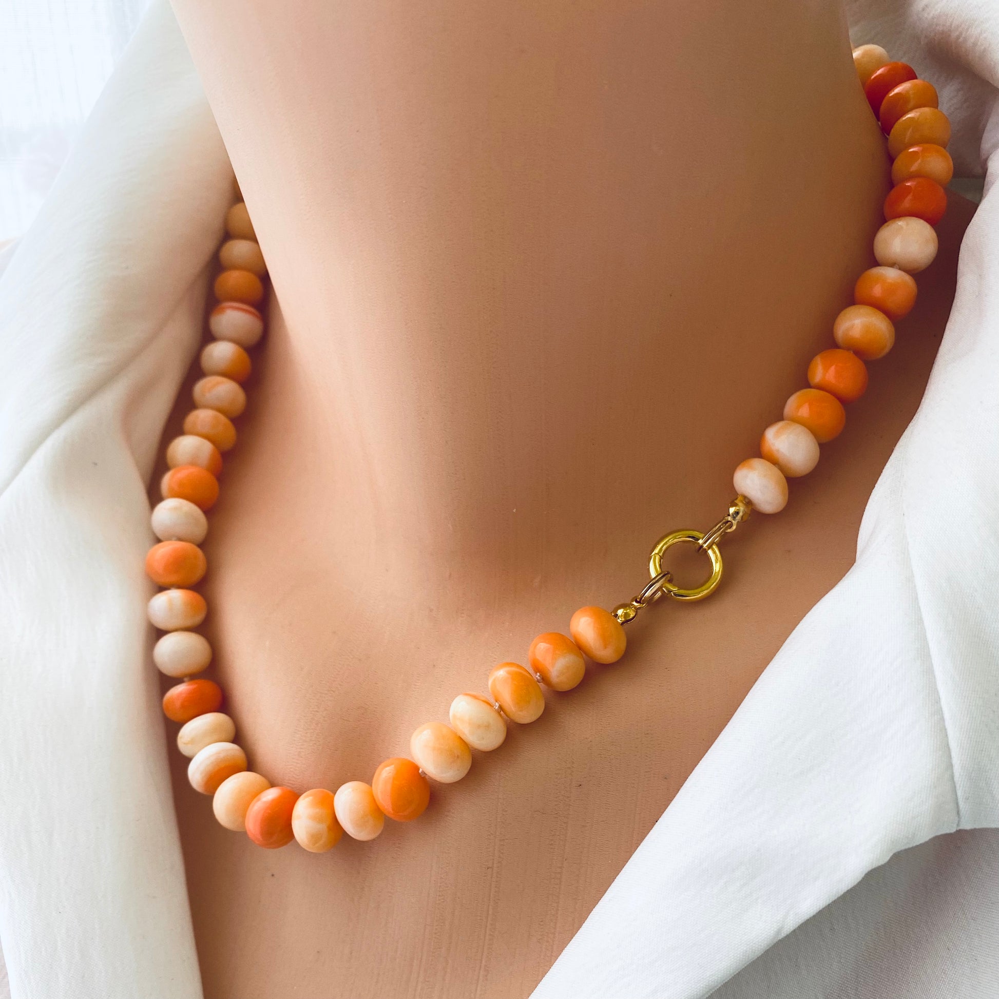 Orange opal candy necklace worn on neck with gold vermeil clasp, handmade gemstone jewelry from Canada