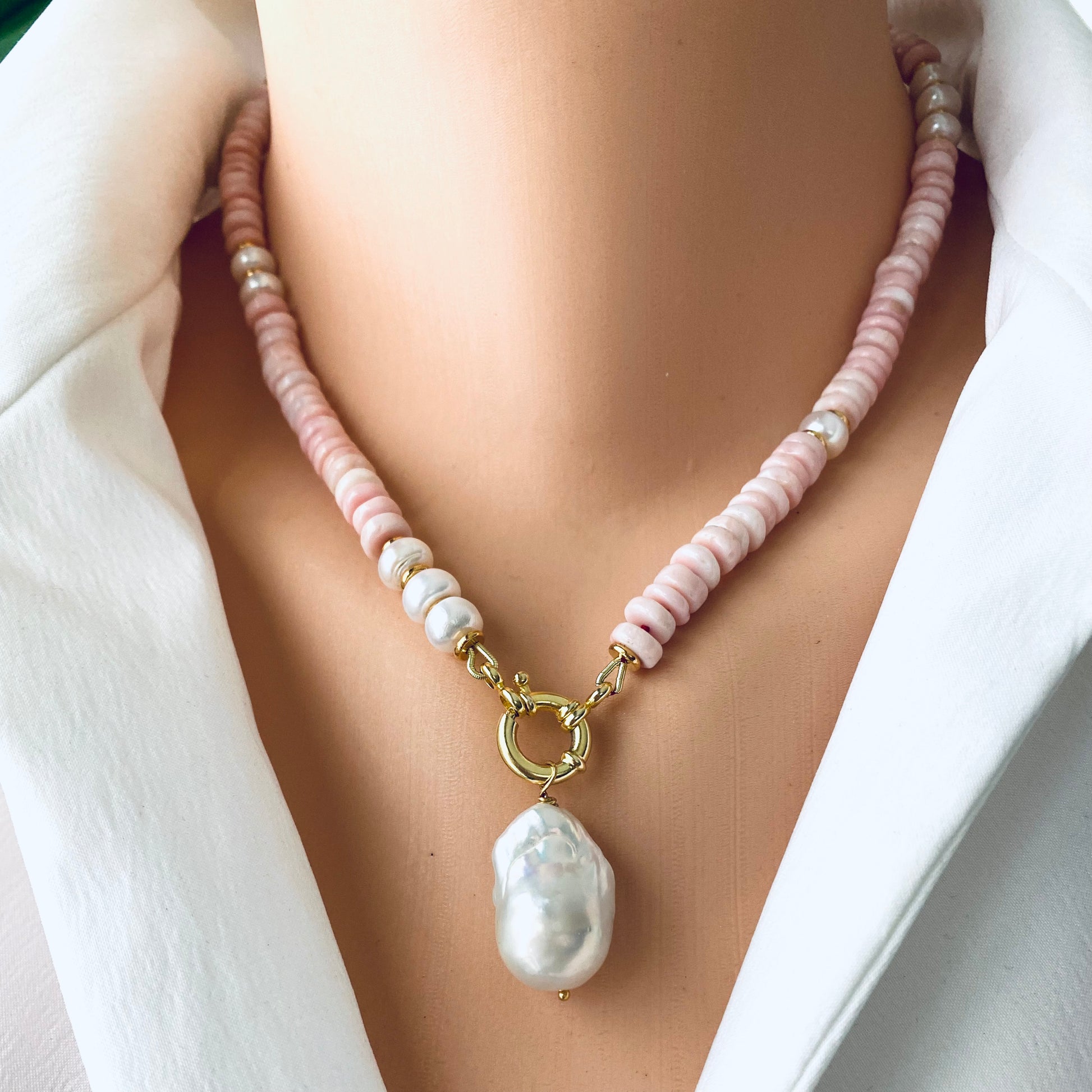 Pink opal pearl necklace worn at the neckline with removable baroque pearl pendant