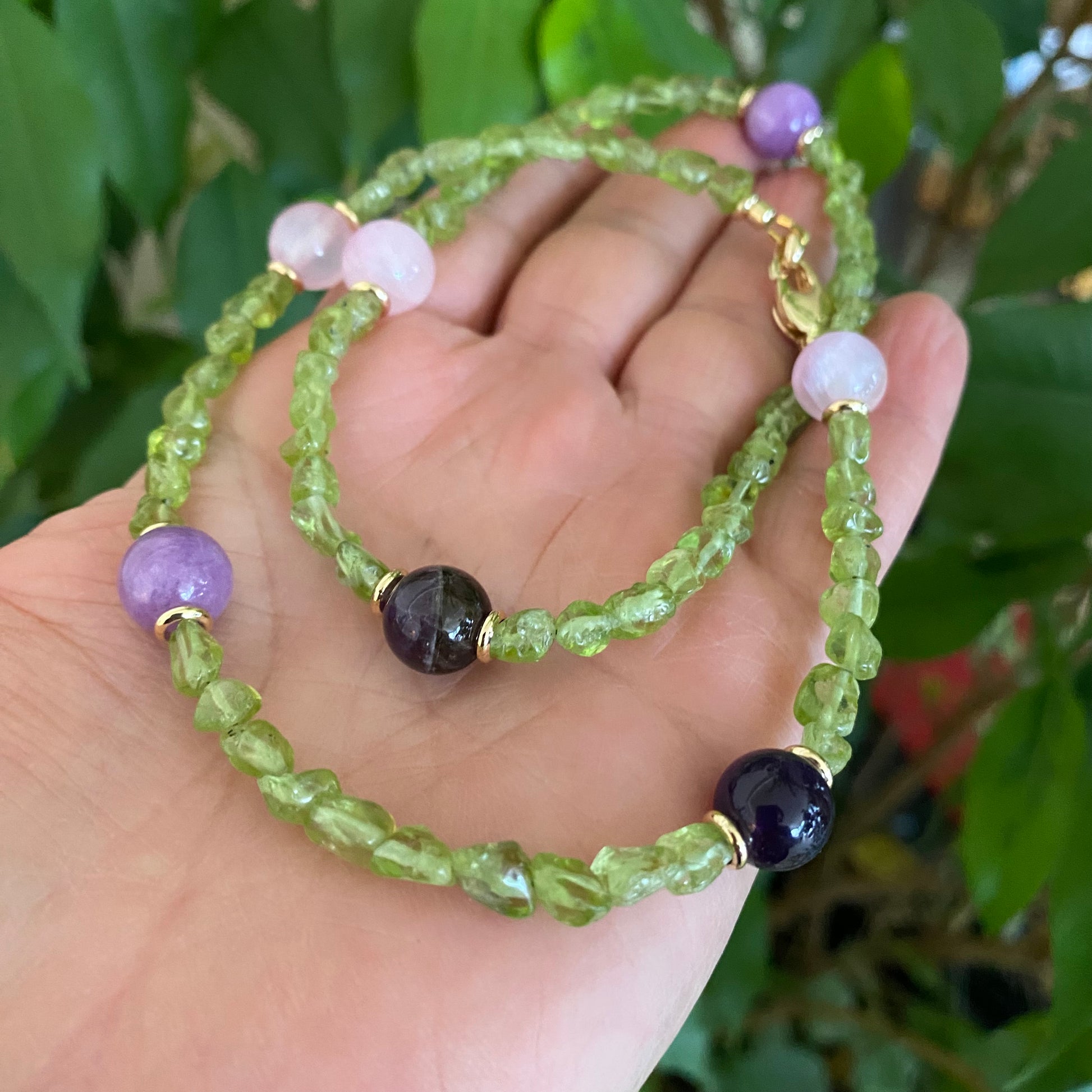 Peridot bonbons necklace with peridot nuggets, rose jade, lilac jade, and amethyst beads, handmade in Canada