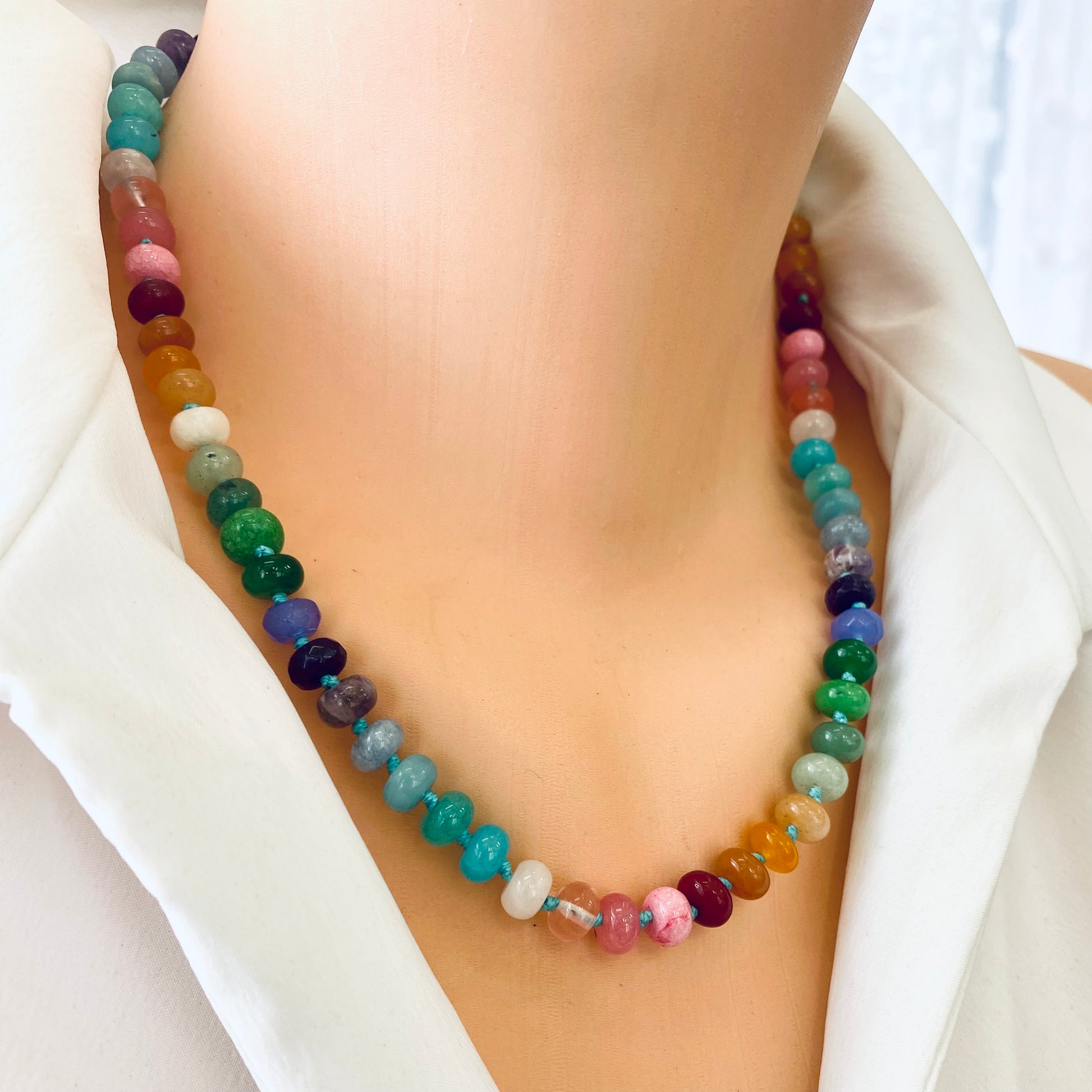Rainbow candy necklace with silver clasp, featuring vibrant natural gemstone rondelle beads in a colorful design.