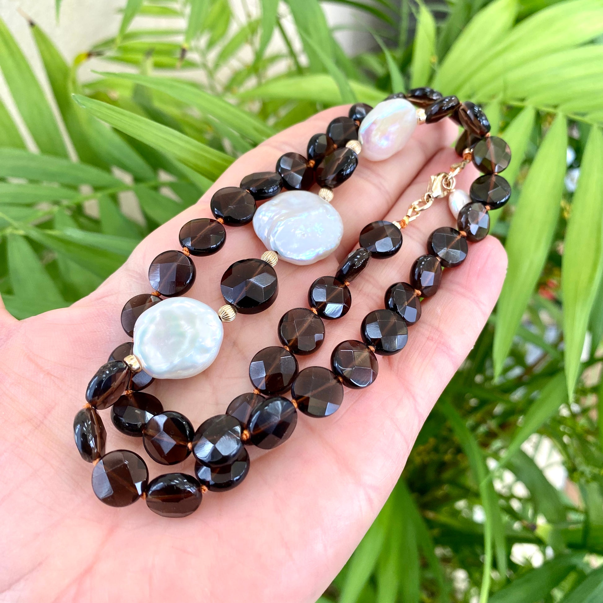 Smoky quartz pearl necklace featuring faceted smoky quartz beads and coin pearls, showcasing earthy tones and elegance.