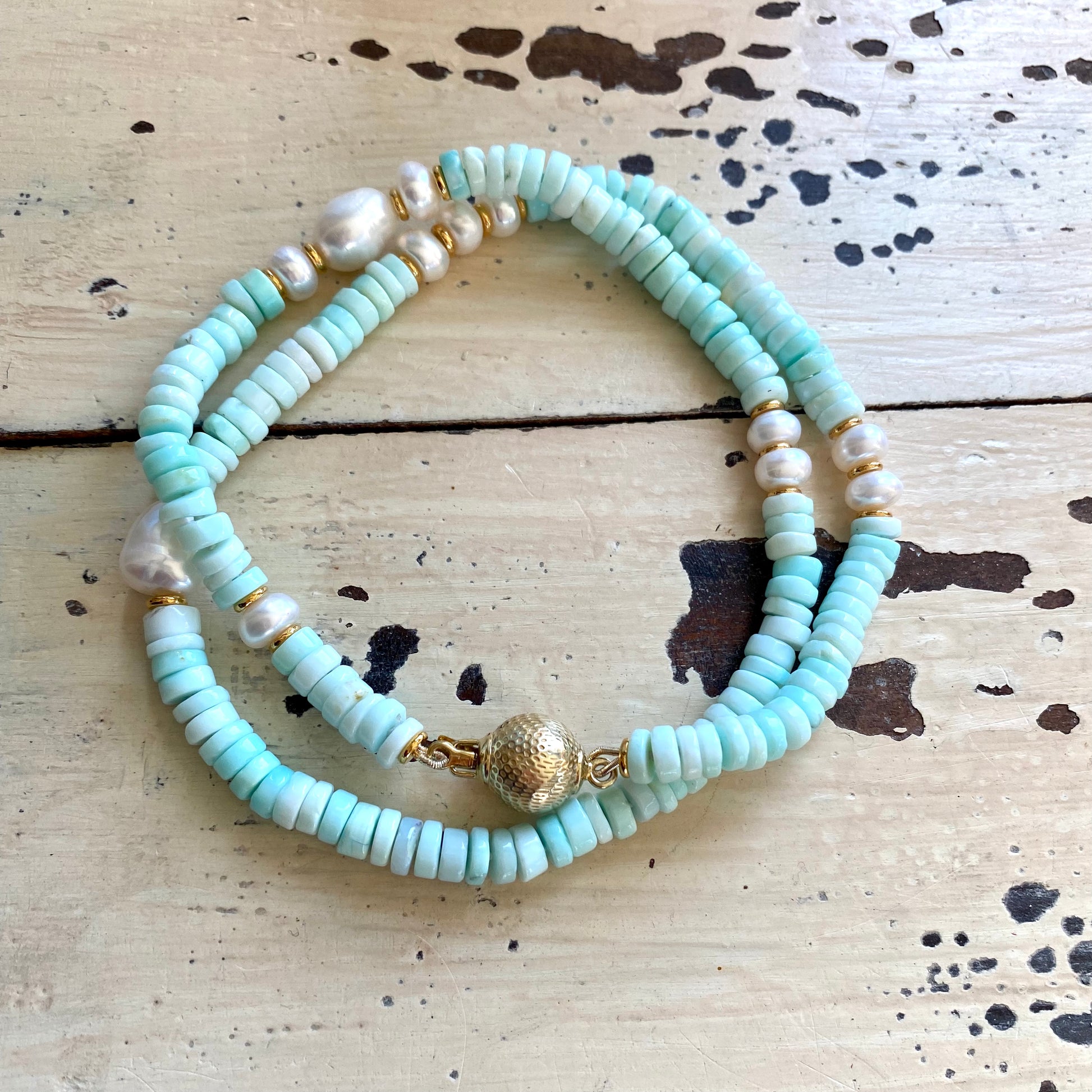 Sky blue opal pearl necklace laid flat with candy-style opal beads and pearls, handmade in Canada