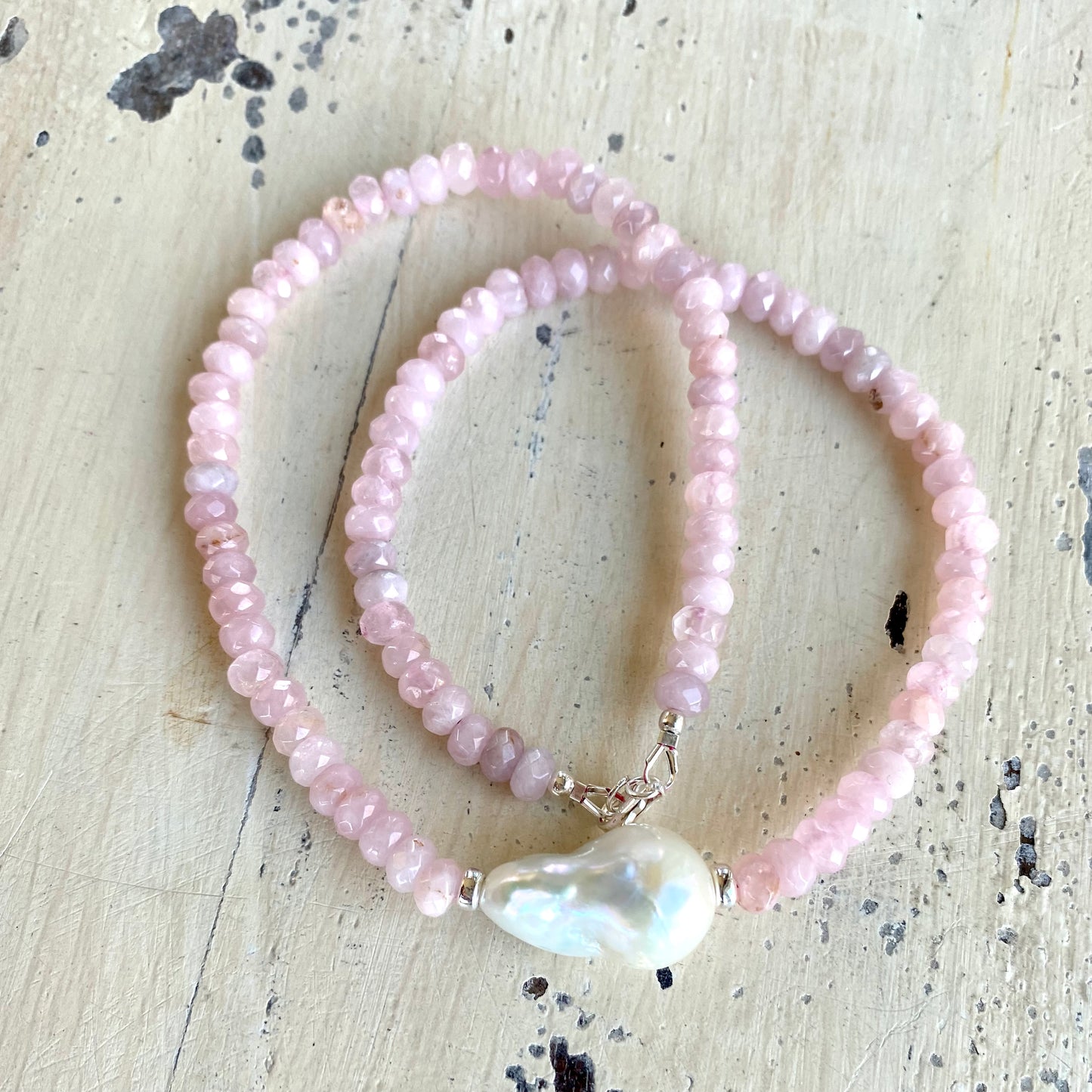 Rose quartz pearl necklace laid flat showing faceted Madagascar rose quartz beads, handcrafted in Canada