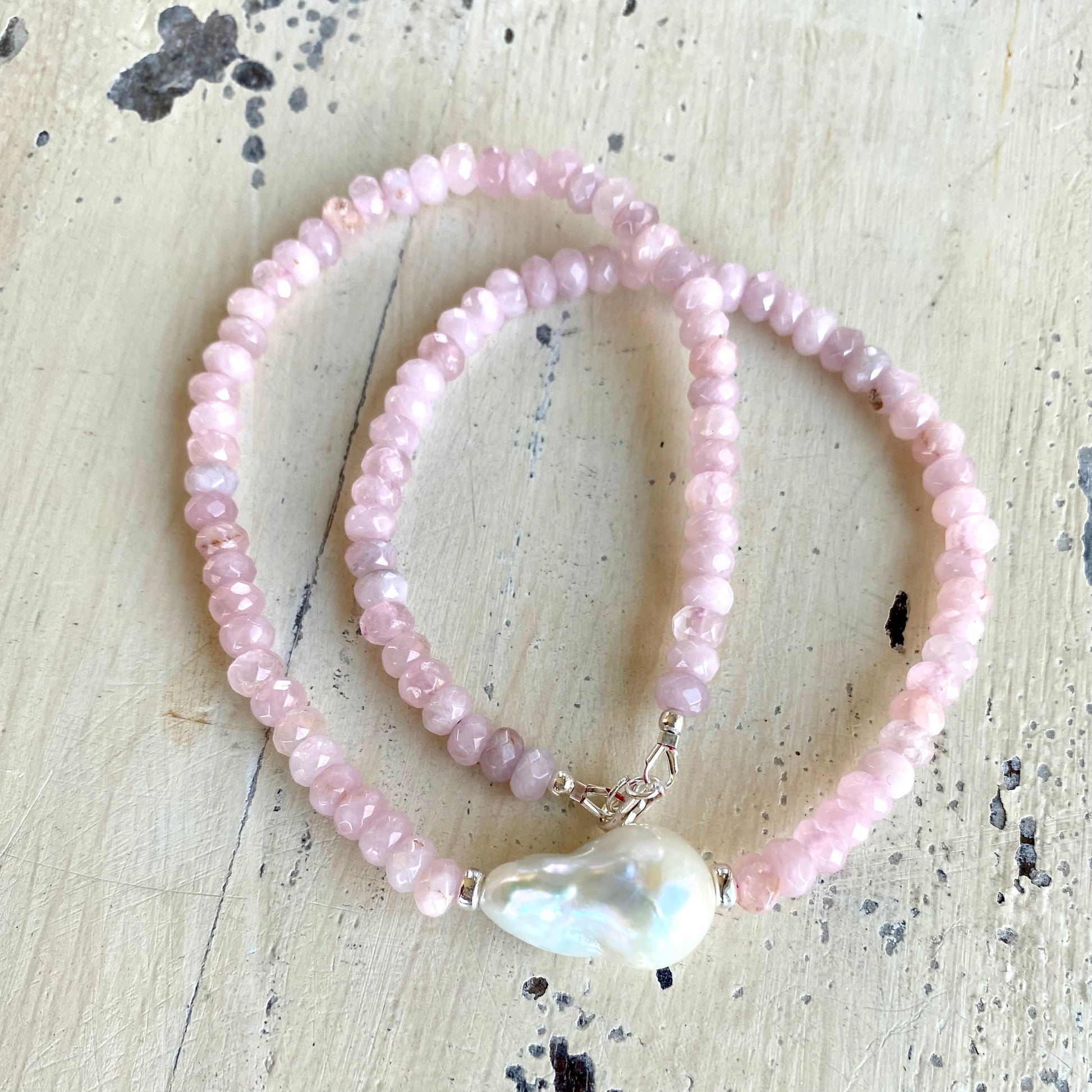 Rose quartz pearl necklace laid flat showing faceted Madagascar rose quartz beads, handcrafted in Canada
