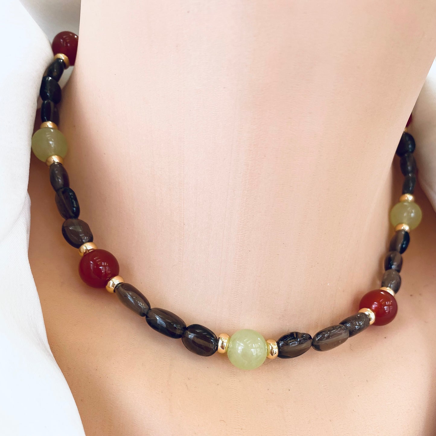 Smoky quartz bonbons choker necklace close-up on neckline, gold plated gemstone jewelry handmade in Canada