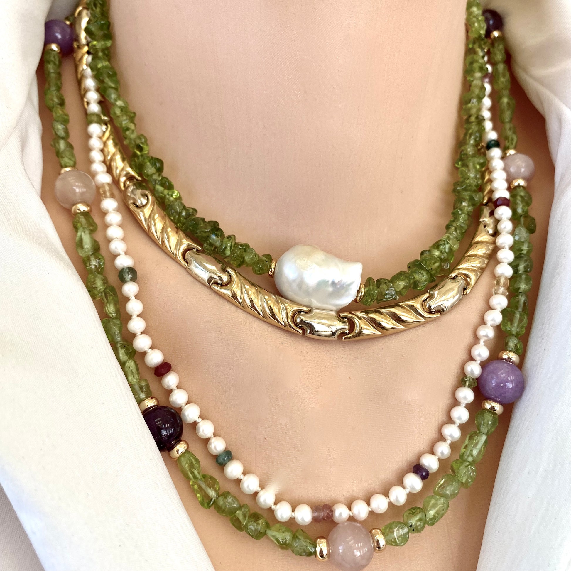 Peridot bonbons necklace layered with gemstone chains, handmade jewelry from Canada close-up