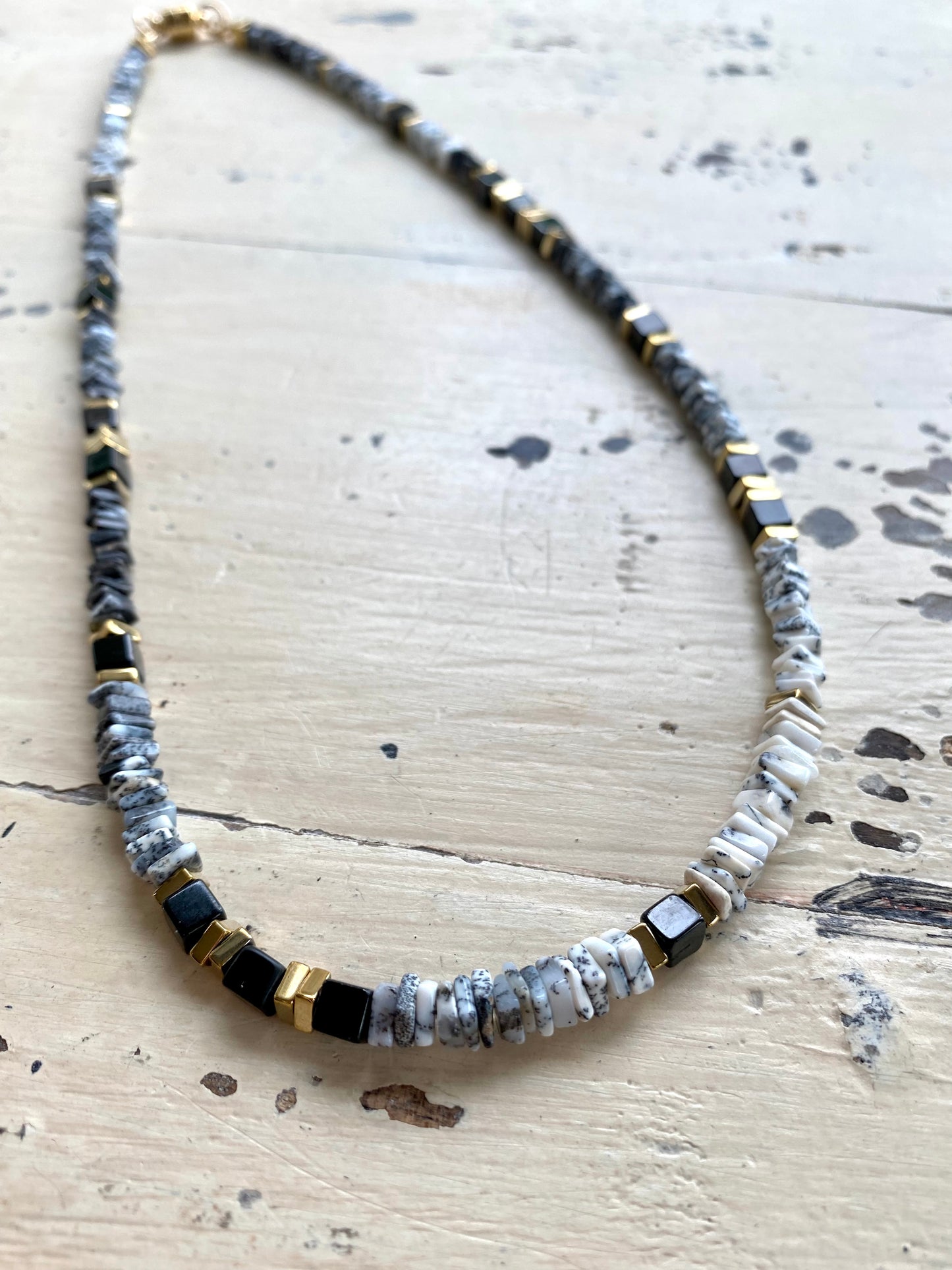 Dendritic opal necklace worn at neckline, clean modern gemstone necklace styling