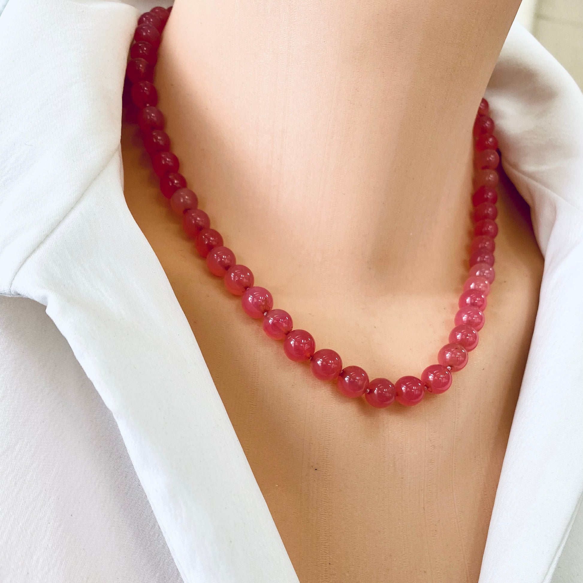 Strawberry quartz cherry necklace close-up, pink gemstone beads with sterling silver clasp, handmade in Canada