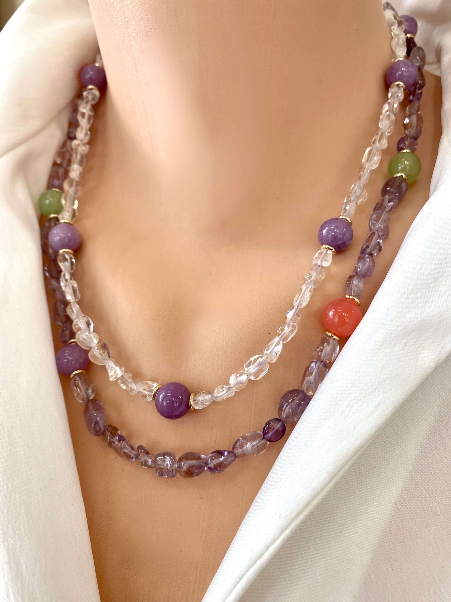 Amethyst gemstone necklace on model, playful multigem strand with gold-plated details