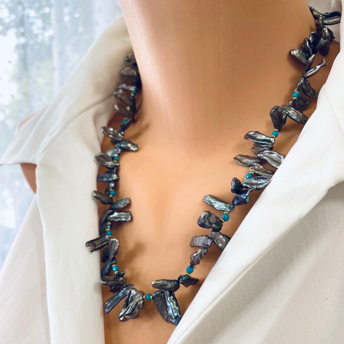 Biwa pearl turquoise necklace on model close-up, organic Biwa pearls with blue turquoise details