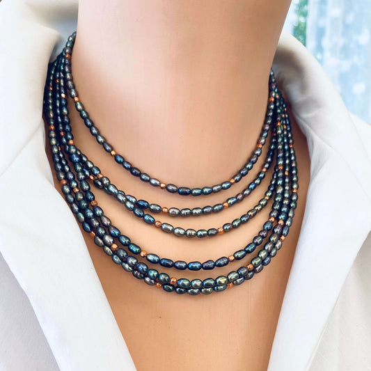Black pearl necklace gold filled layered on model, mini rice pearls with copper beads for a stacked look