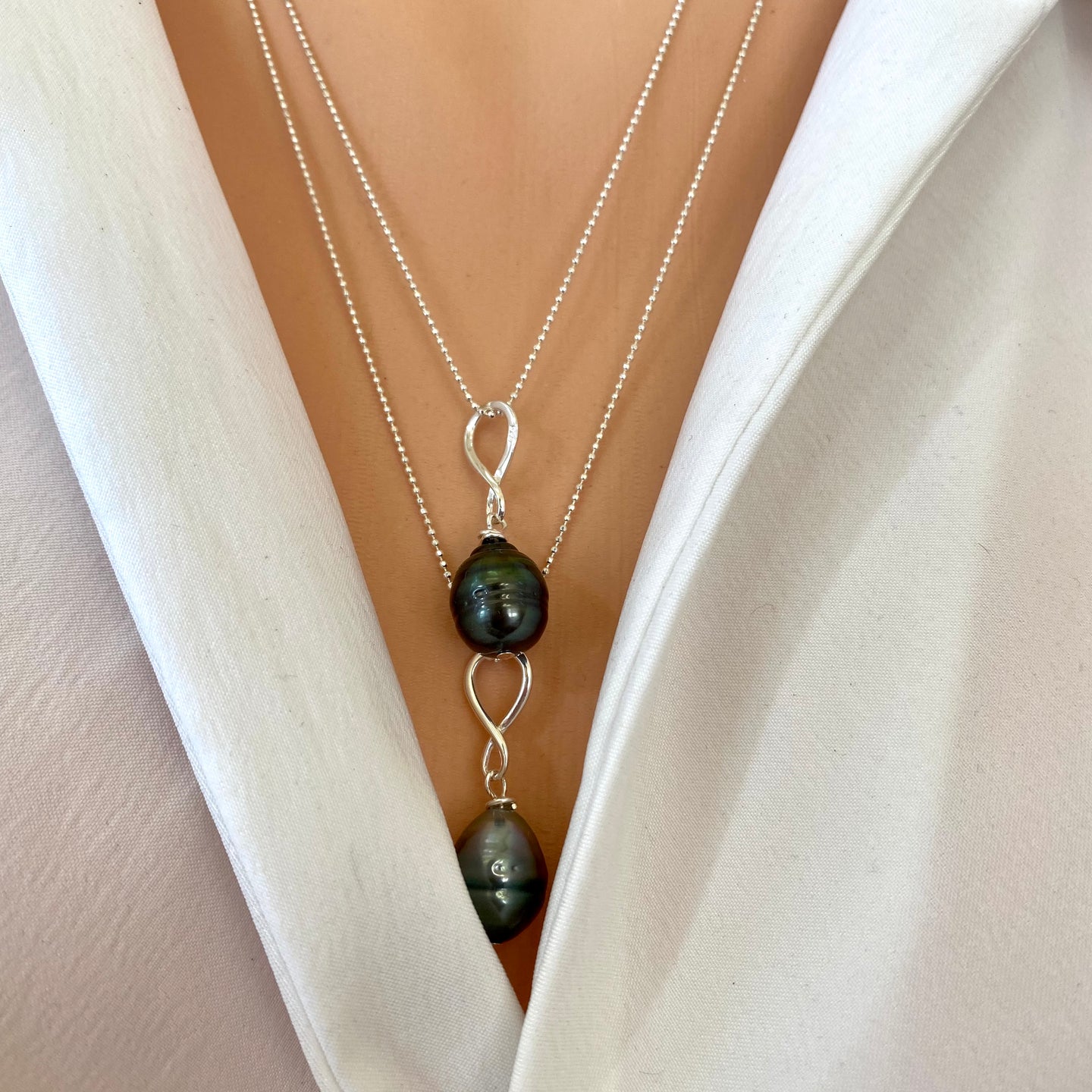 Black Tahitian teardrop pearl pendant on a sterling silver ball chain, available in 20 or 22 inches. This elegant handmade jewelry piece is a perfect June birthstone gift for her.