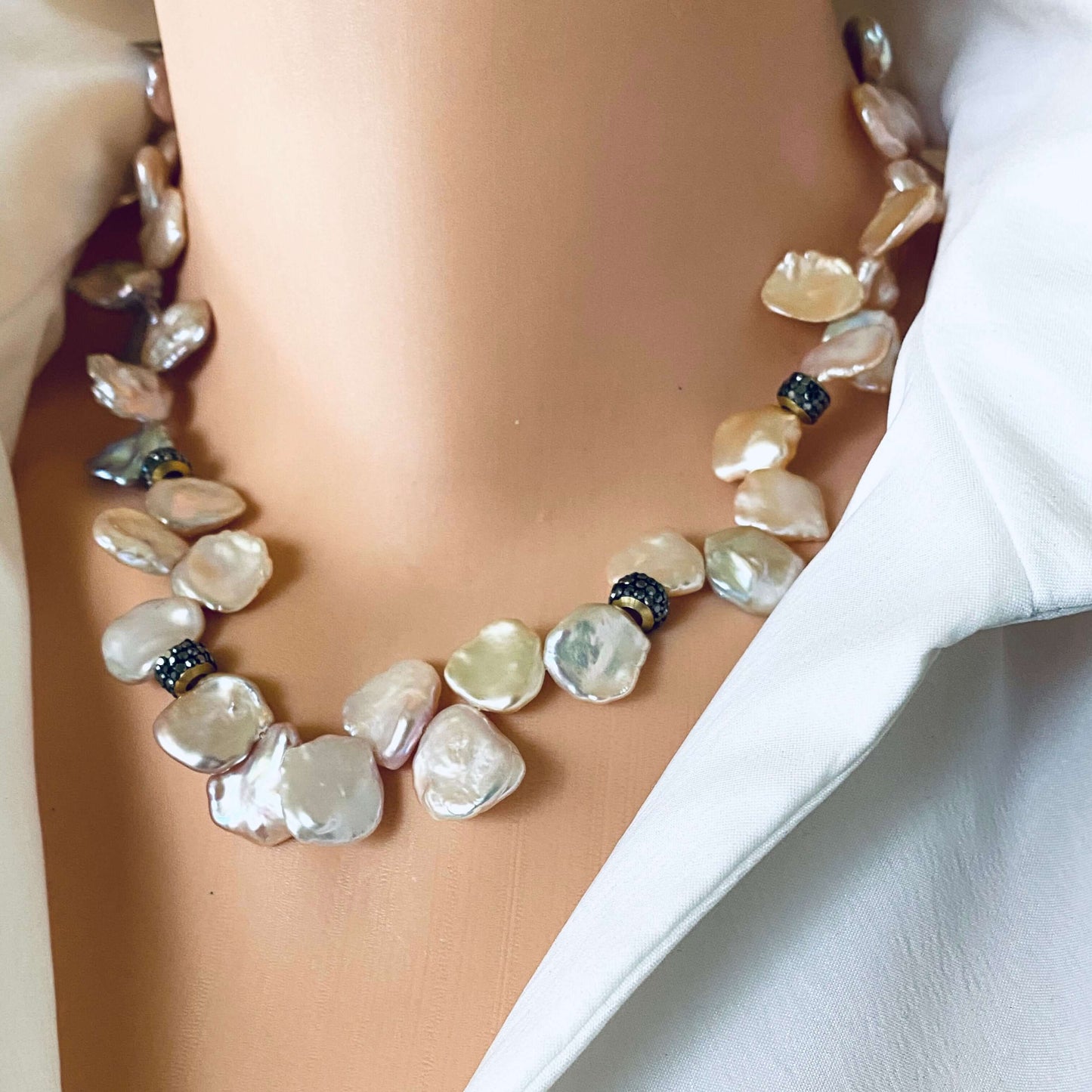 Pink lavender petal pearls choker necklace showcasing iridescent freshwater pearls on a mannequin.