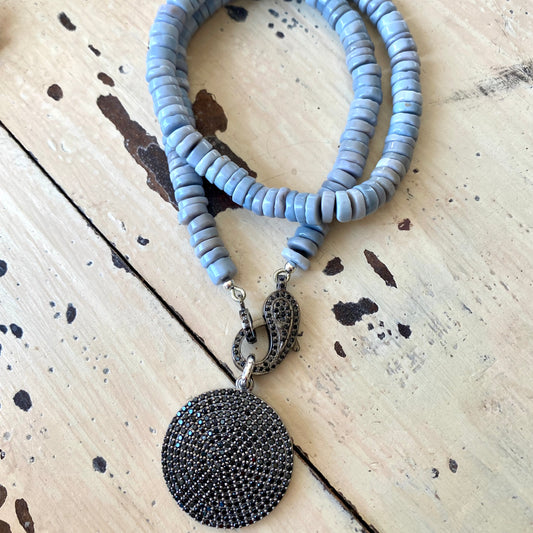 Oregon blue opal candy necklace laid flat with tire-shaped opal beads and black spinel pendant, handmade Canadian jewelry
