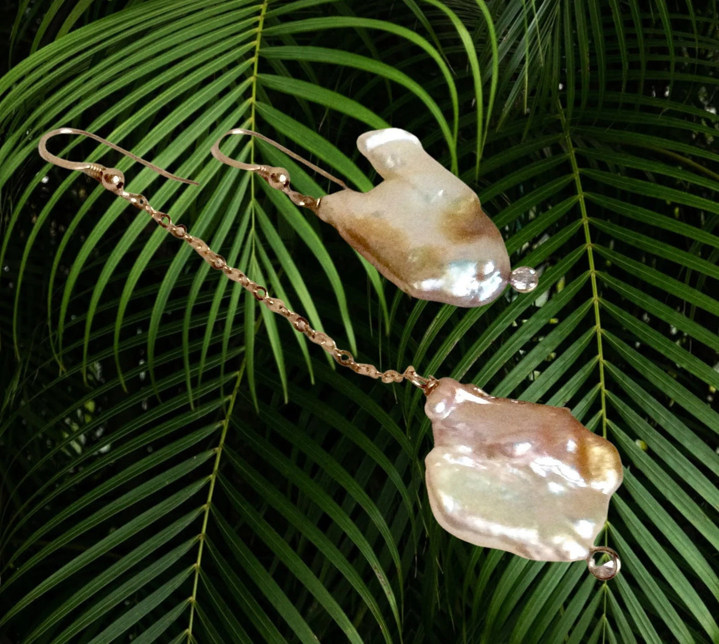 Mismatched Pearl Drop Earrings featuring asymmetrical design with clear CZ and 14k gold filled accents.