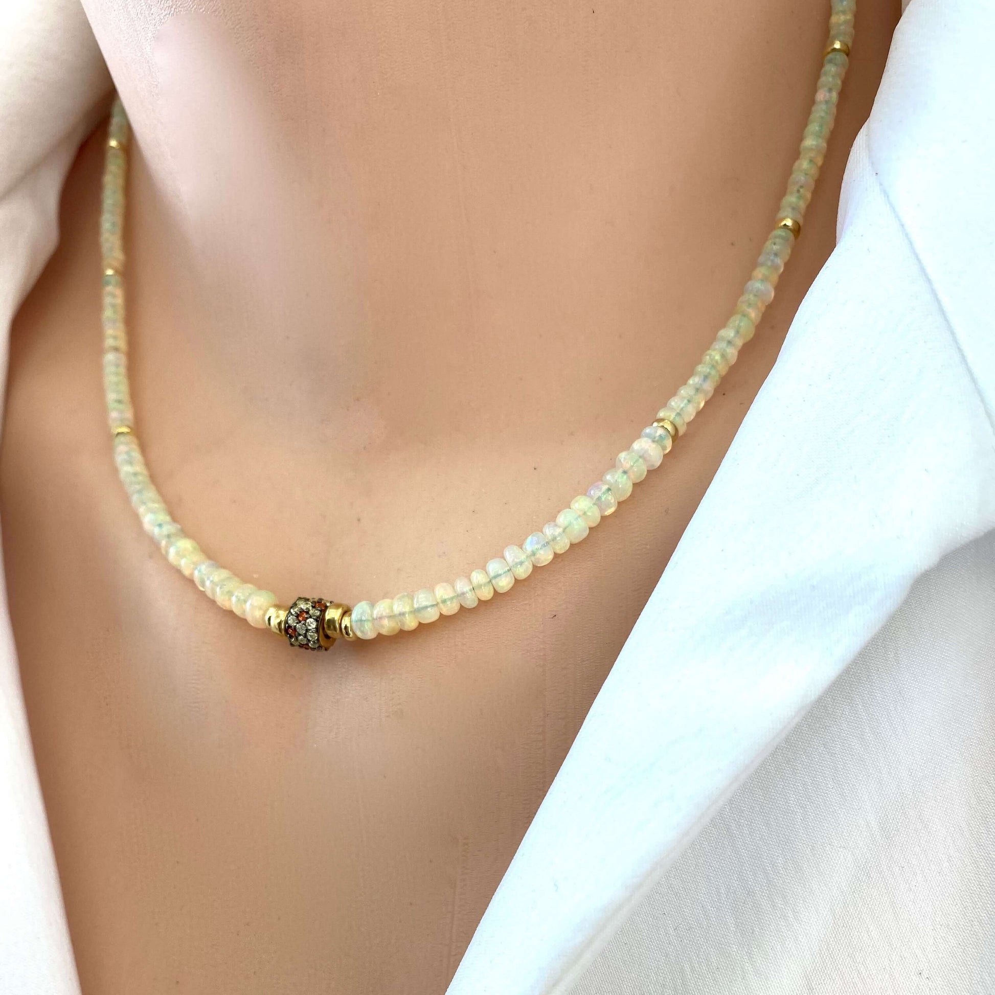 Ethiopian opal necklace worn on model, delicate opal bead strand with gold vermeil accents